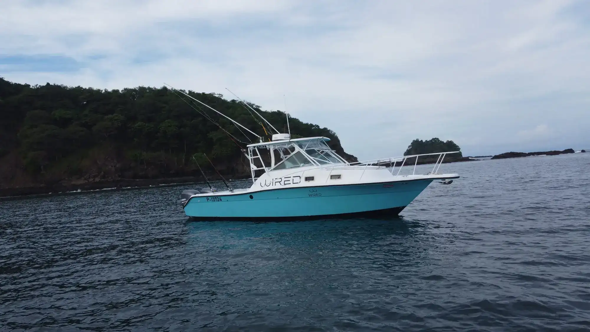 Wired sportfishing boat in a Costa Rica cove